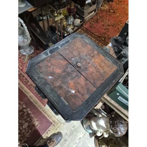 425 - A Victorian walnut floor standing stereoscopic viewer, partially filled with slides, height 121cm.