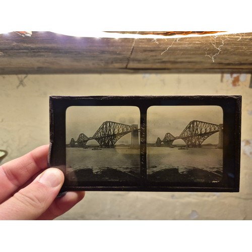 425 - A Victorian walnut floor standing stereoscopic viewer, partially filled with slides, height 121cm.