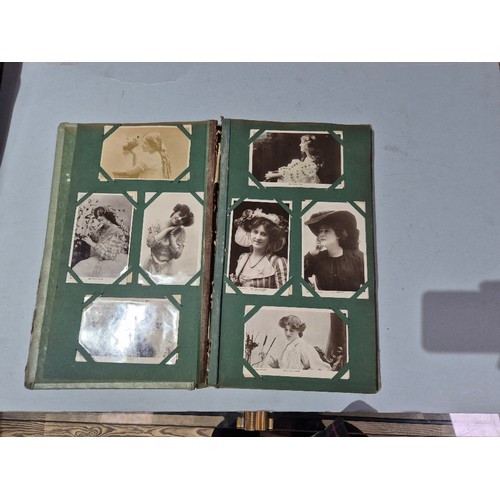 450 - A box of assorted photograph and postcard albums.