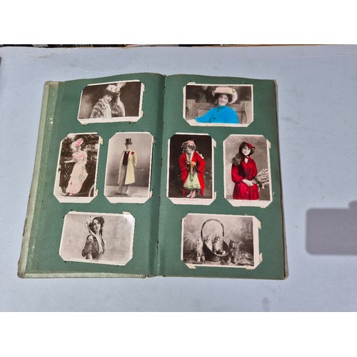 450 - A box of assorted photograph and postcard albums.