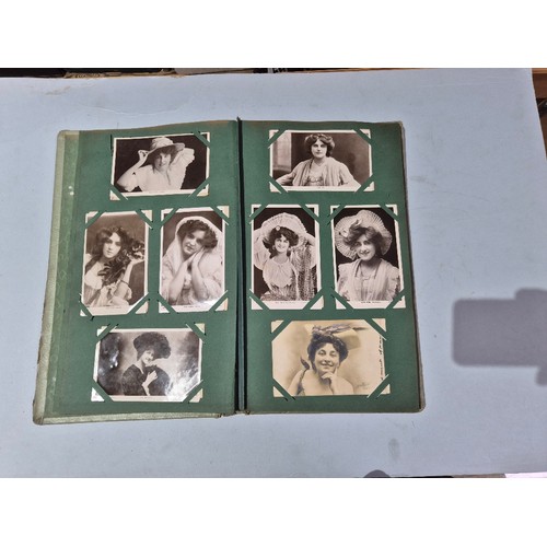 450 - A box of assorted photograph and postcard albums.