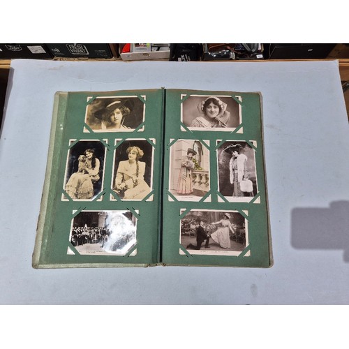 450 - A box of assorted photograph and postcard albums.