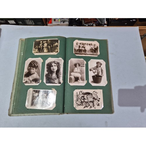450 - A box of assorted photograph and postcard albums.
