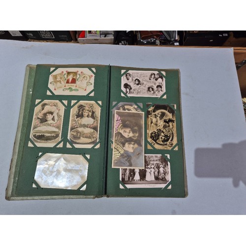 450 - A box of assorted photograph and postcard albums.