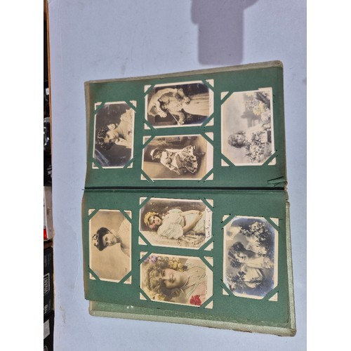 450 - A box of assorted photograph and postcard albums.