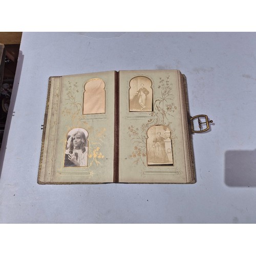 450 - A box of assorted photograph and postcard albums.