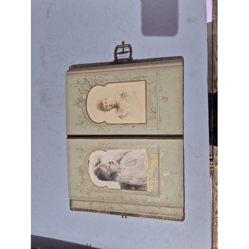 450 - A box of assorted photograph and postcard albums.
