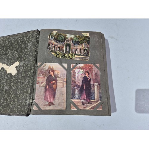 450 - A box of assorted photograph and postcard albums.