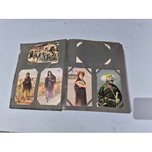 450 - A box of assorted photograph and postcard albums.