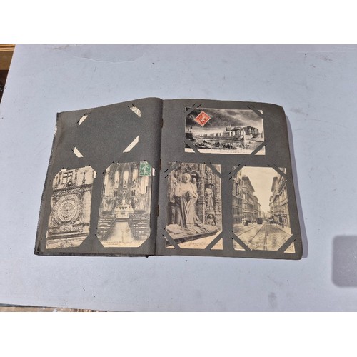 450 - A box of assorted photograph and postcard albums.