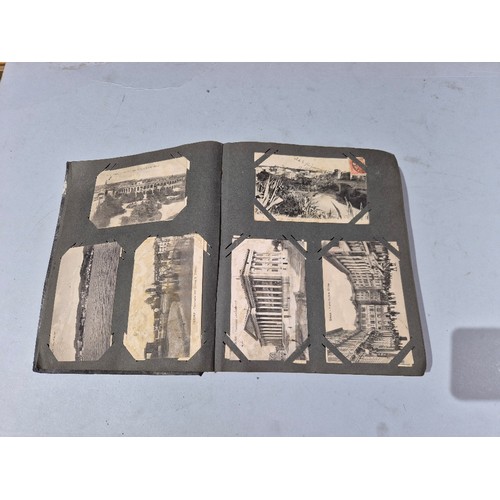 450 - A box of assorted photograph and postcard albums.