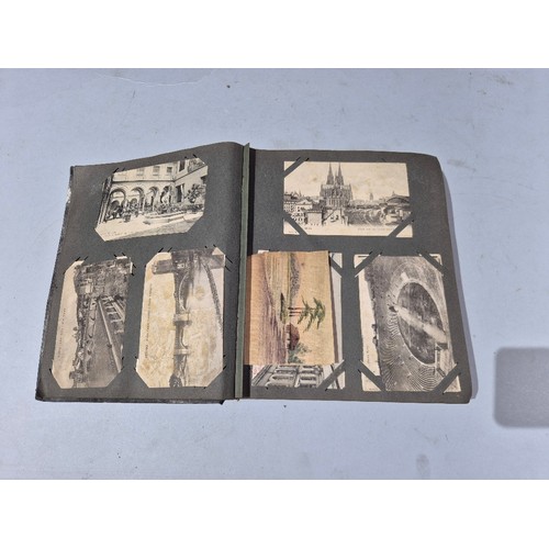 450 - A box of assorted photograph and postcard albums.