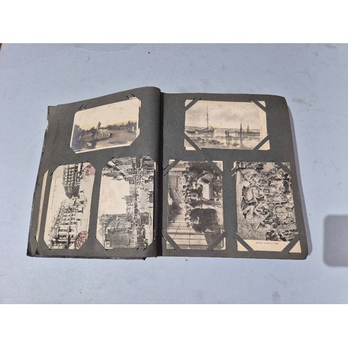 450 - A box of assorted photograph and postcard albums.