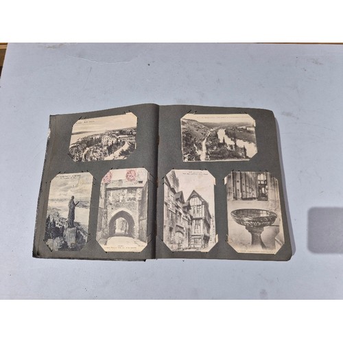 450 - A box of assorted photograph and postcard albums.