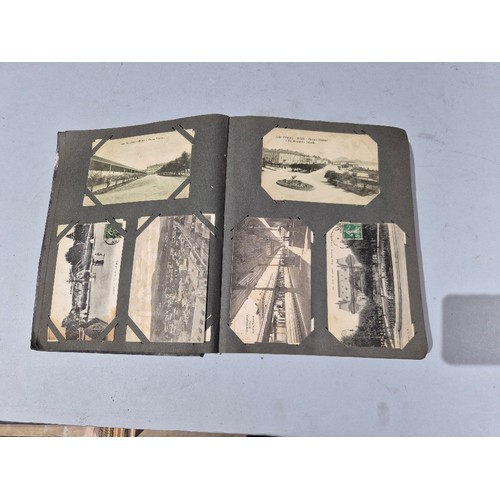 450 - A box of assorted photograph and postcard albums.