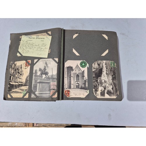 450 - A box of assorted photograph and postcard albums.