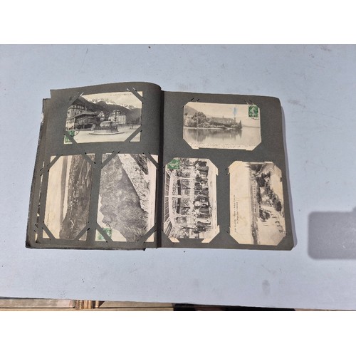 450 - A box of assorted photograph and postcard albums.