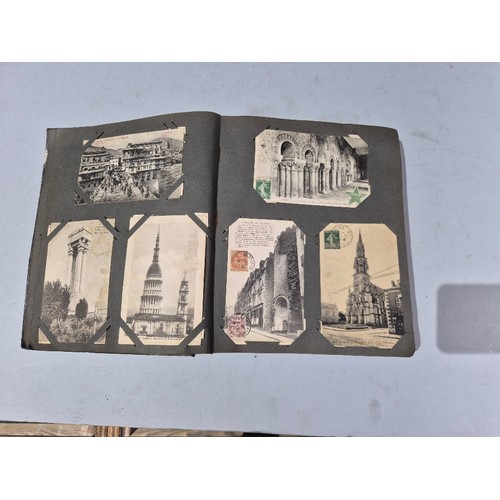 450 - A box of assorted photograph and postcard albums.