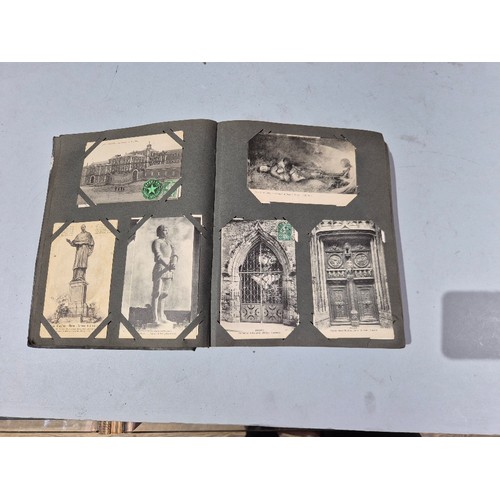 450 - A box of assorted photograph and postcard albums.
