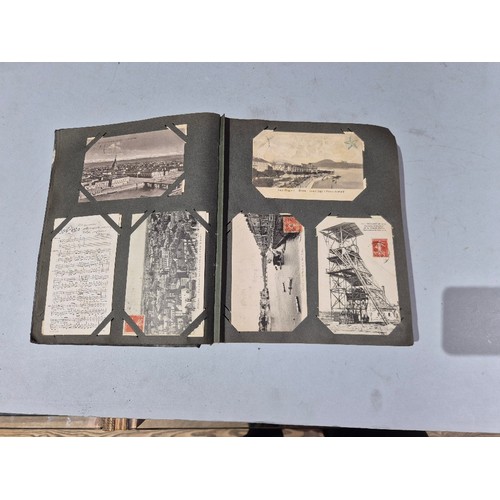 450 - A box of assorted photograph and postcard albums.