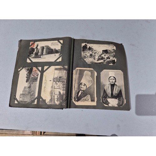 450 - A box of assorted photograph and postcard albums.