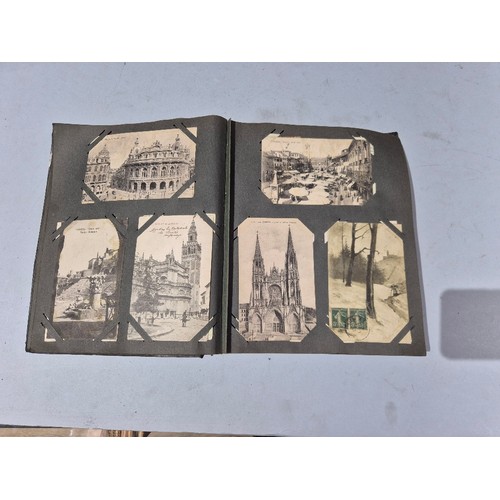450 - A box of assorted photograph and postcard albums.