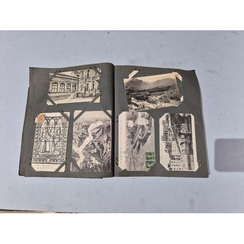 450 - A box of assorted photograph and postcard albums.