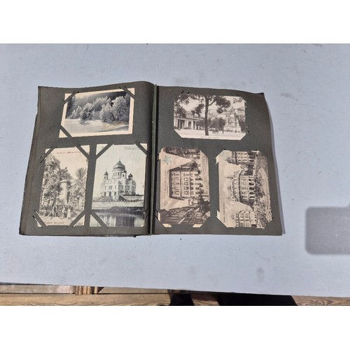 450 - A box of assorted photograph and postcard albums.