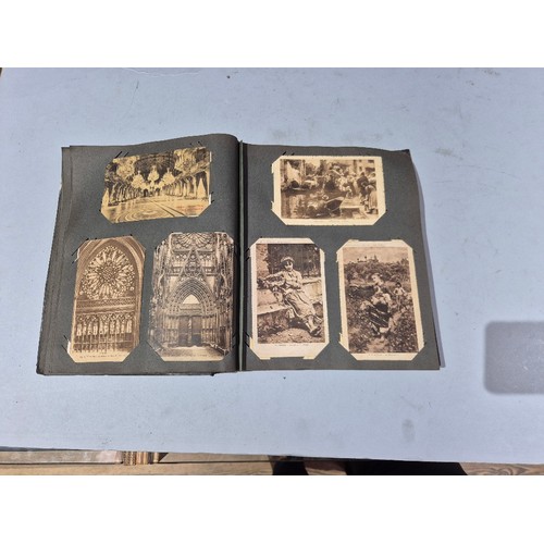 450 - A box of assorted photograph and postcard albums.