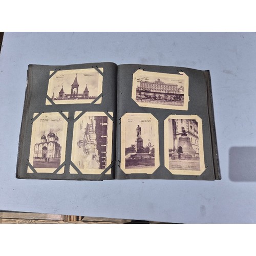 450 - A box of assorted photograph and postcard albums.