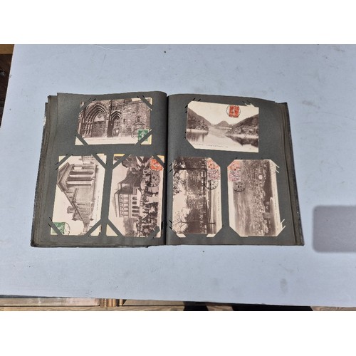 450 - A box of assorted photograph and postcard albums.