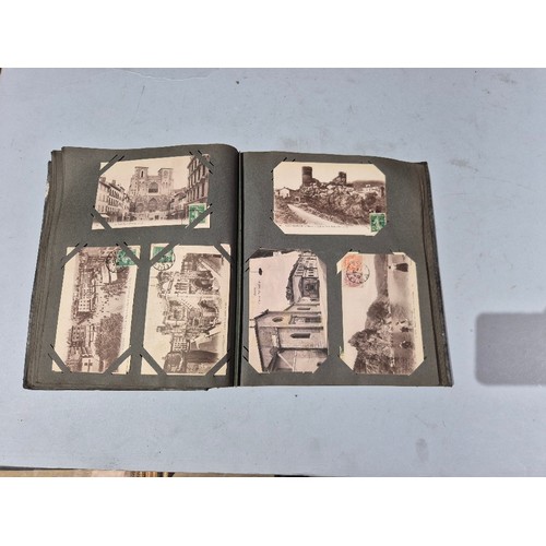 450 - A box of assorted photograph and postcard albums.