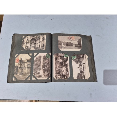 450 - A box of assorted photograph and postcard albums.
