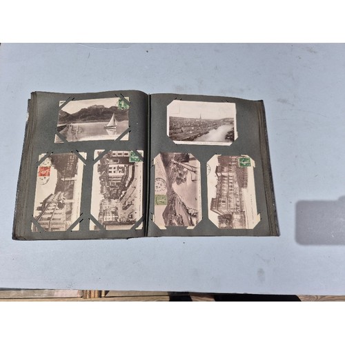 450 - A box of assorted photograph and postcard albums.