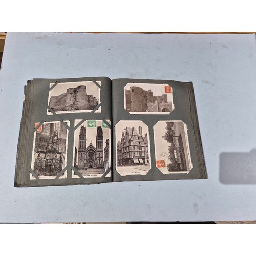 450 - A box of assorted photograph and postcard albums.