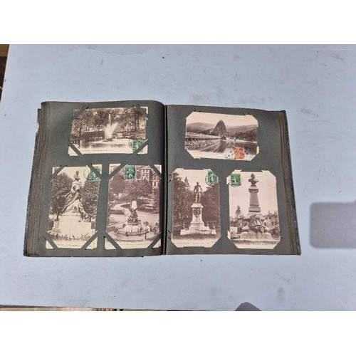 450 - A box of assorted photograph and postcard albums.