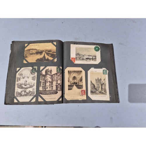 450 - A box of assorted photograph and postcard albums.