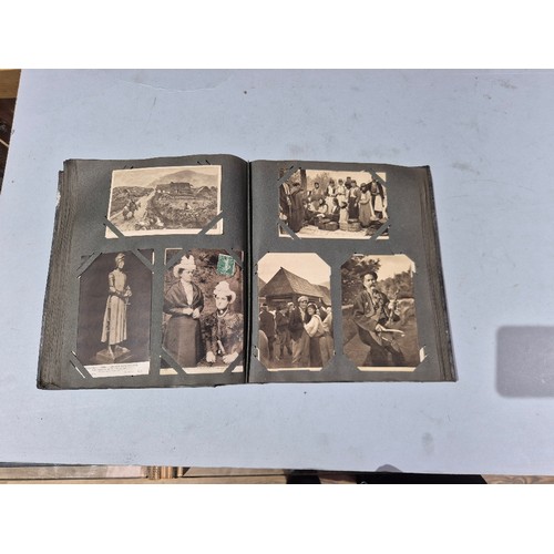 450 - A box of assorted photograph and postcard albums.