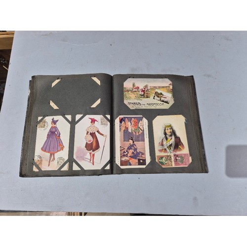 450 - A box of assorted photograph and postcard albums.