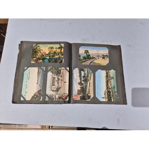 450 - A box of assorted photograph and postcard albums.