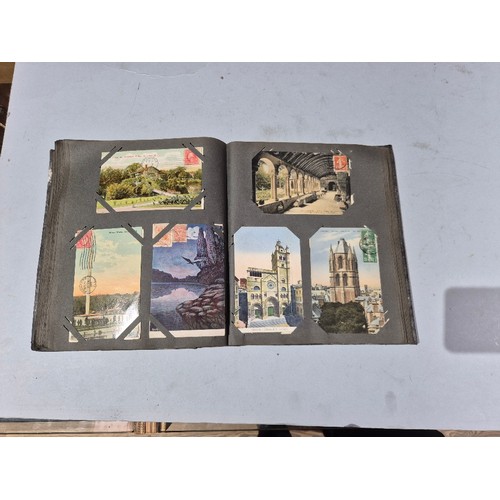 450 - A box of assorted photograph and postcard albums.