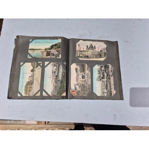 450 - A box of assorted photograph and postcard albums.