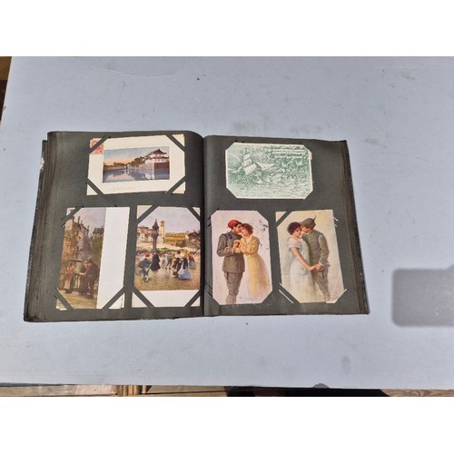 450 - A box of assorted photograph and postcard albums.