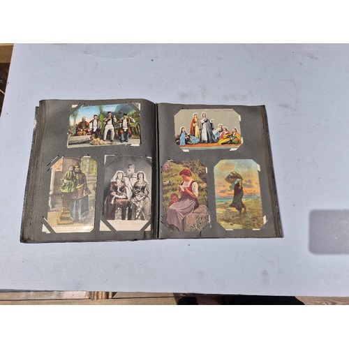 450 - A box of assorted photograph and postcard albums.