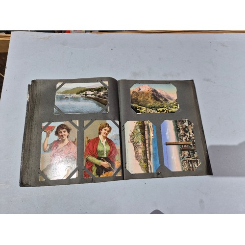 450 - A box of assorted photograph and postcard albums.