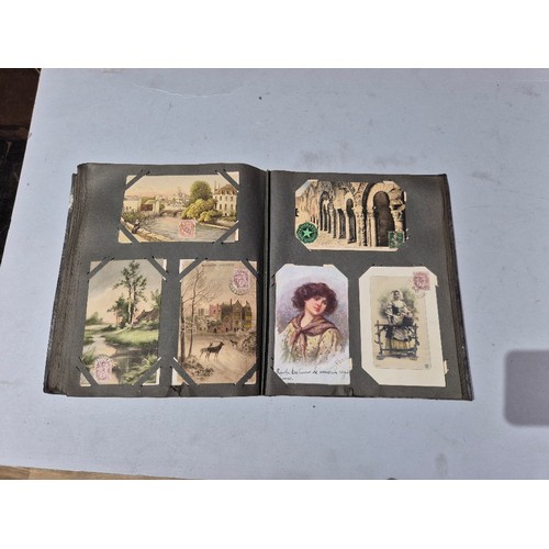 450 - A box of assorted photograph and postcard albums.