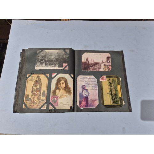 450 - A box of assorted photograph and postcard albums.