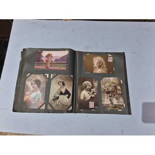 450 - A box of assorted photograph and postcard albums.