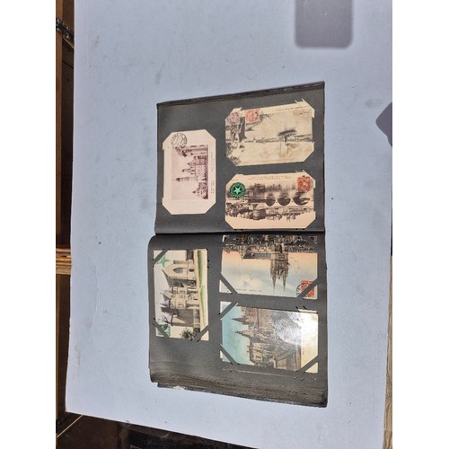 450 - A box of assorted photograph and postcard albums.