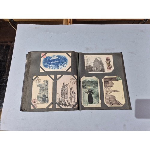 450 - A box of assorted photograph and postcard albums.
